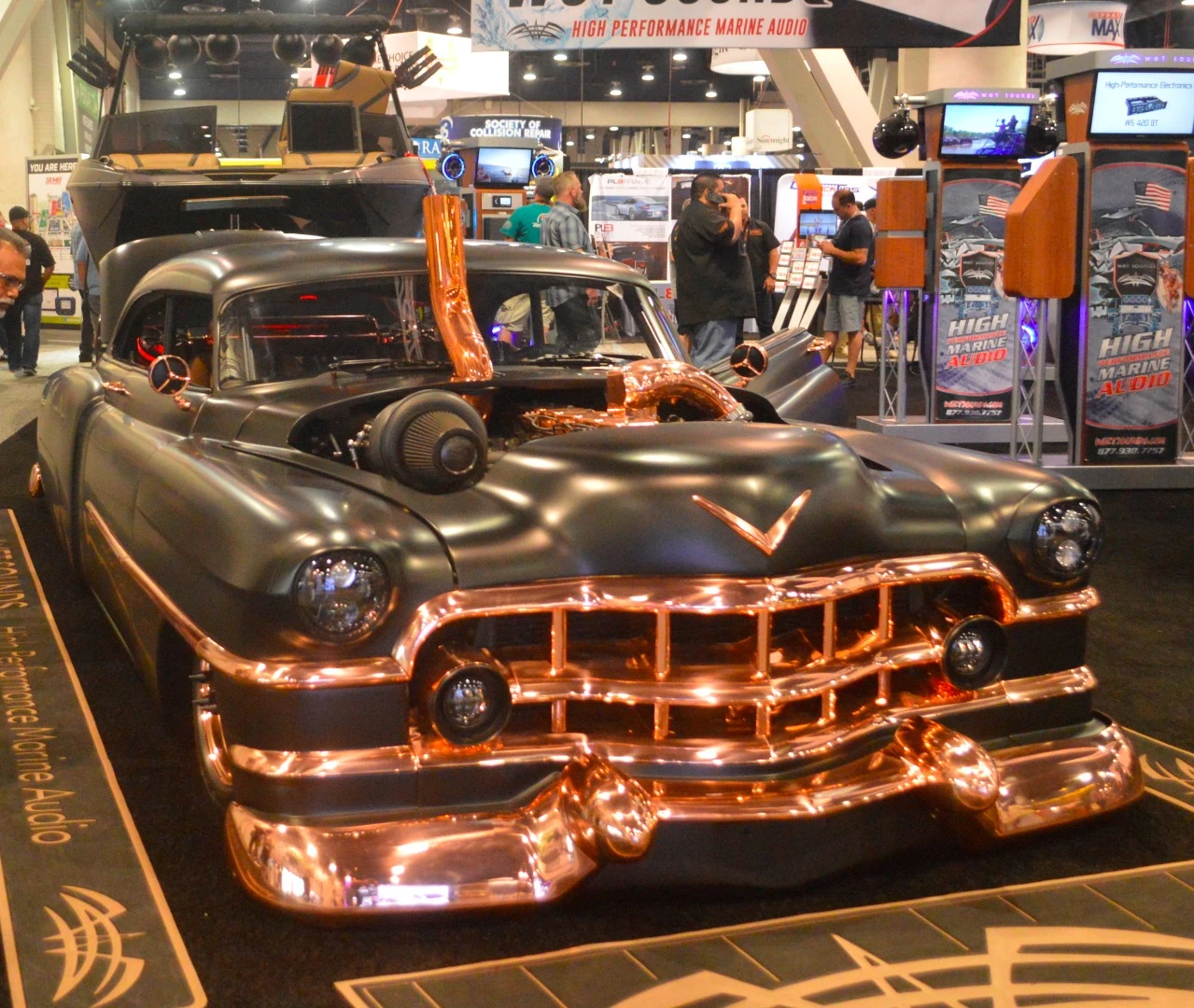 This shiny car wouldn't be our first choice to tow a boat to the lake, but it sure looks good doing it at SEMA