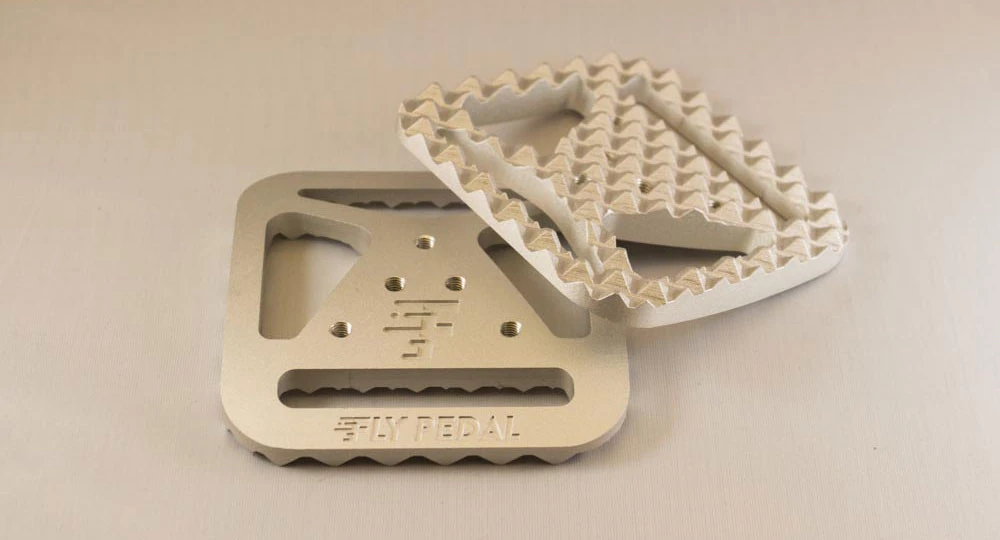 By attaching cleats to the underside of the FlyPedal adapter, they will clip in and out of the clipless pedals in much the same way a pair of bike shoes would