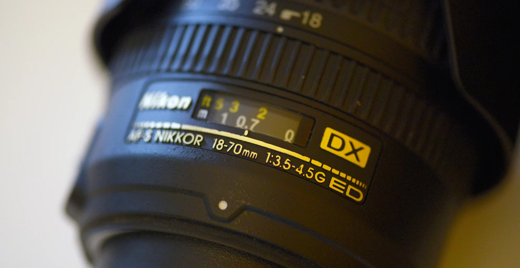 The almost sentence-long collection of letters and numbers on the side of a lens barrel can tell you all sorts of things about a lens