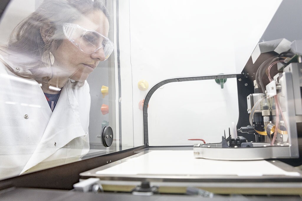 Eloise Bihar looks on as the inkjet-printed paper sensors are created