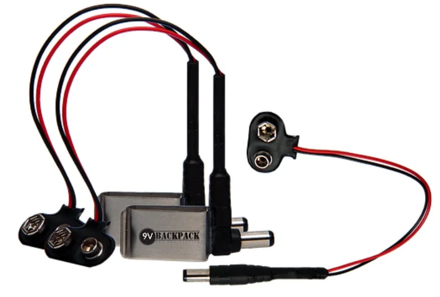 The 9 V Backpack comes in two flavors, one with a metal clip for holding a battery and one without