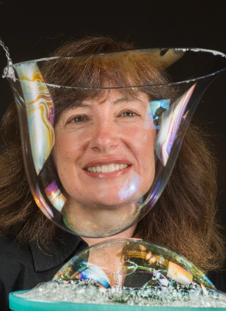 Sandia National Laboratories researcher Susan Rempe peers through bubbles