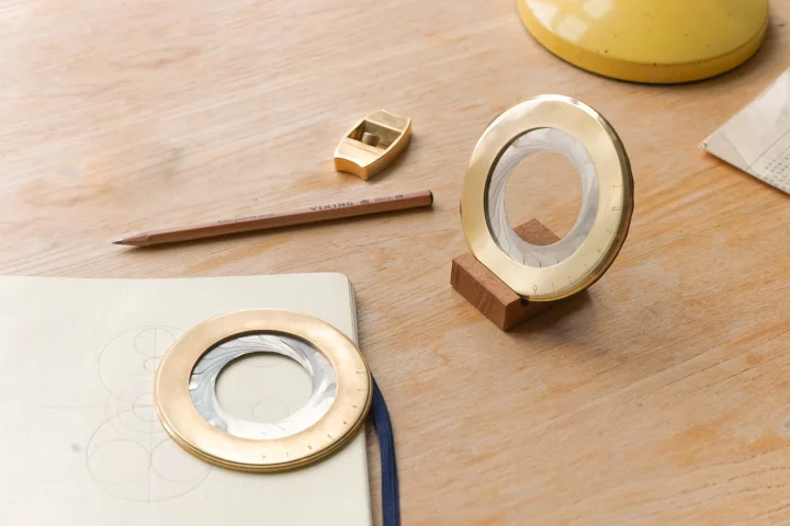 The Iris, shown with its wooden base, alongside Makers Cabinet's first Kickstarter project, the Høvel