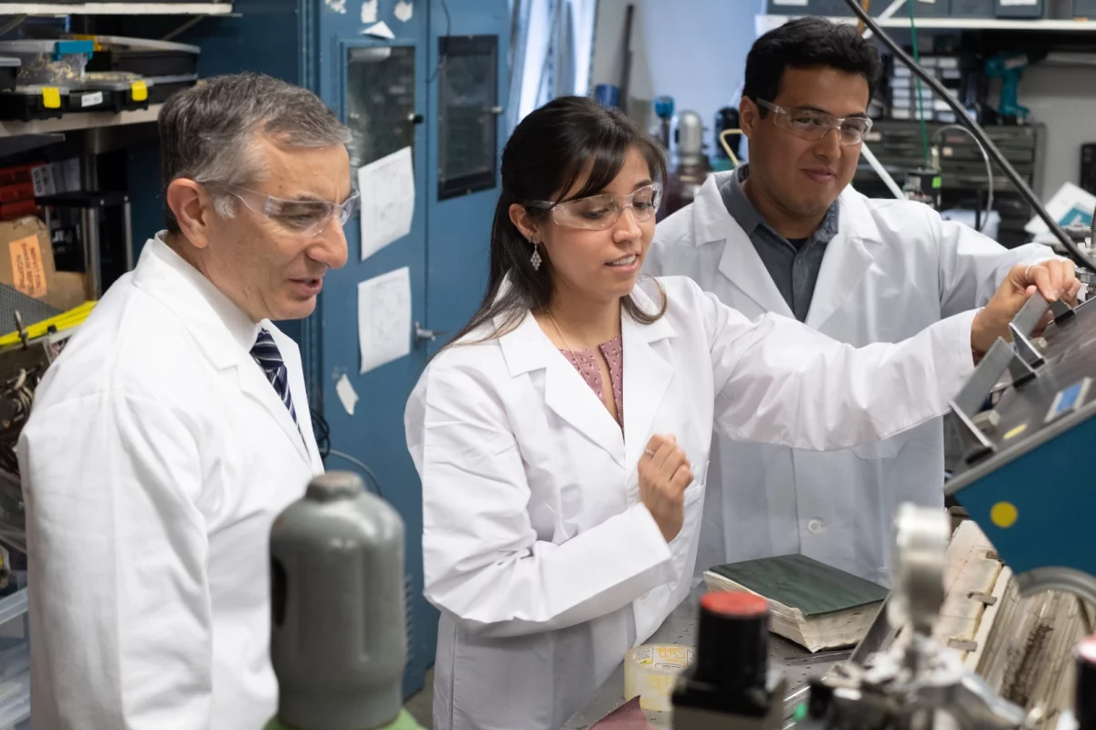 Rice University chemist James Tour, left, graduate student Gladys López-Silva and postdoctoral researcher Rodrigo Salvatierra have come up with a new kind of battery that prevents dendrite growth