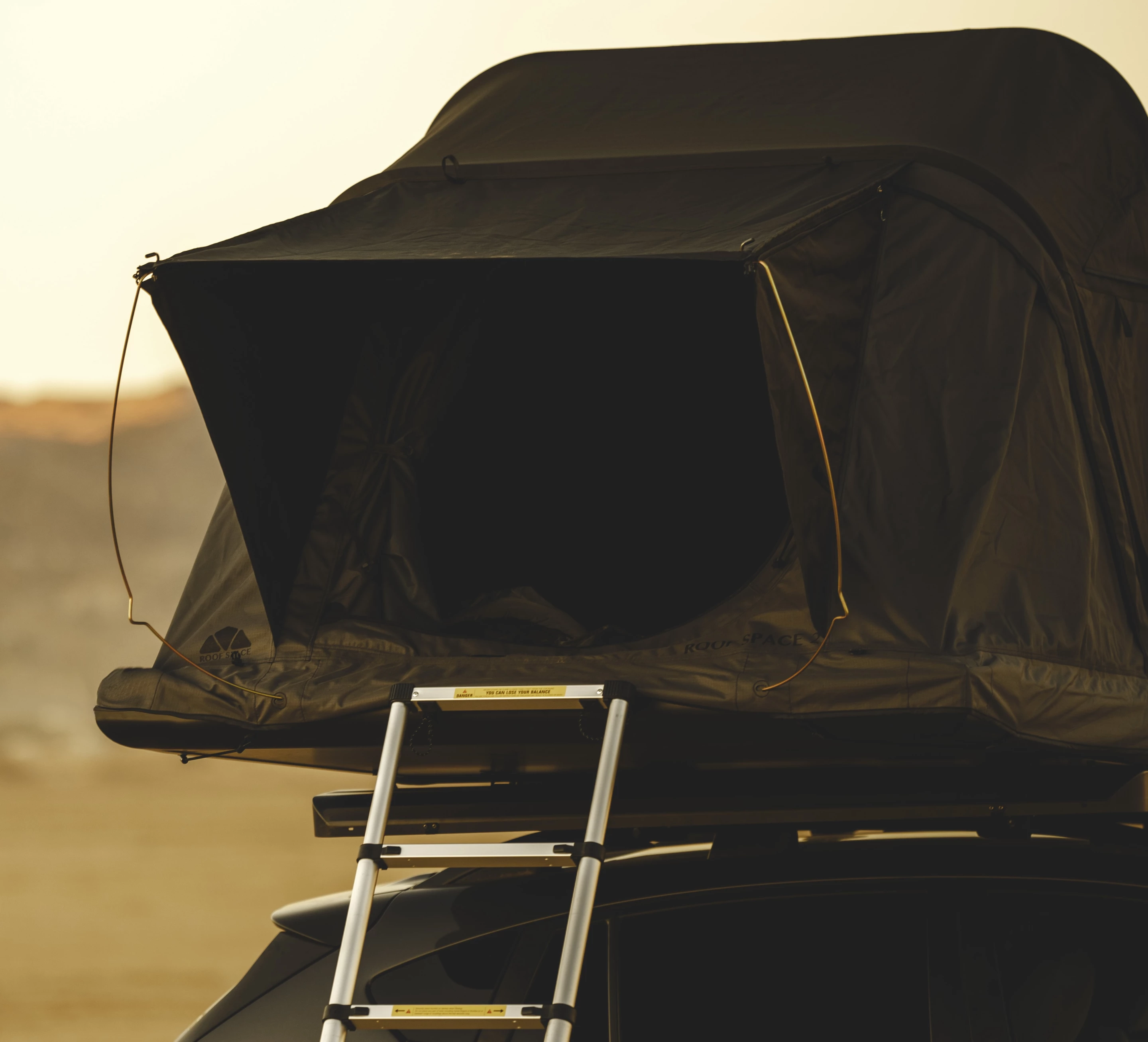 The Roof Space 2 includes a 120-in telescoping ladder and spring steel awning supports
