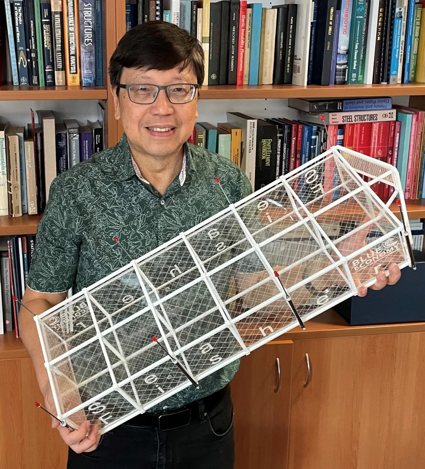 Prof. Chien Ming Wang with a model of the SeaFisher