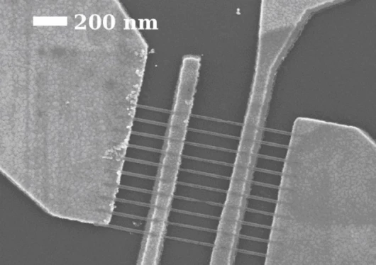 Scanning electron microscope image of graphene nanoribbons that are 22 nanometers wide between the middle electrode pair. Pic credit: Raghunath Murali