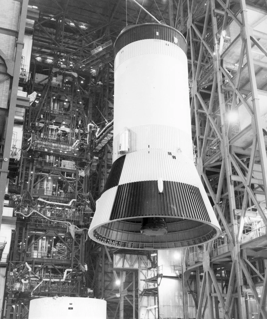 The third stage (S-IVB) of the Saturn V launch vehicle for the Apollo 11 lunar landing mission is hoisted in the vehicle assembly building at the NASA Kennedy Space Center (KSC) for mating with the second stage (S-II)
