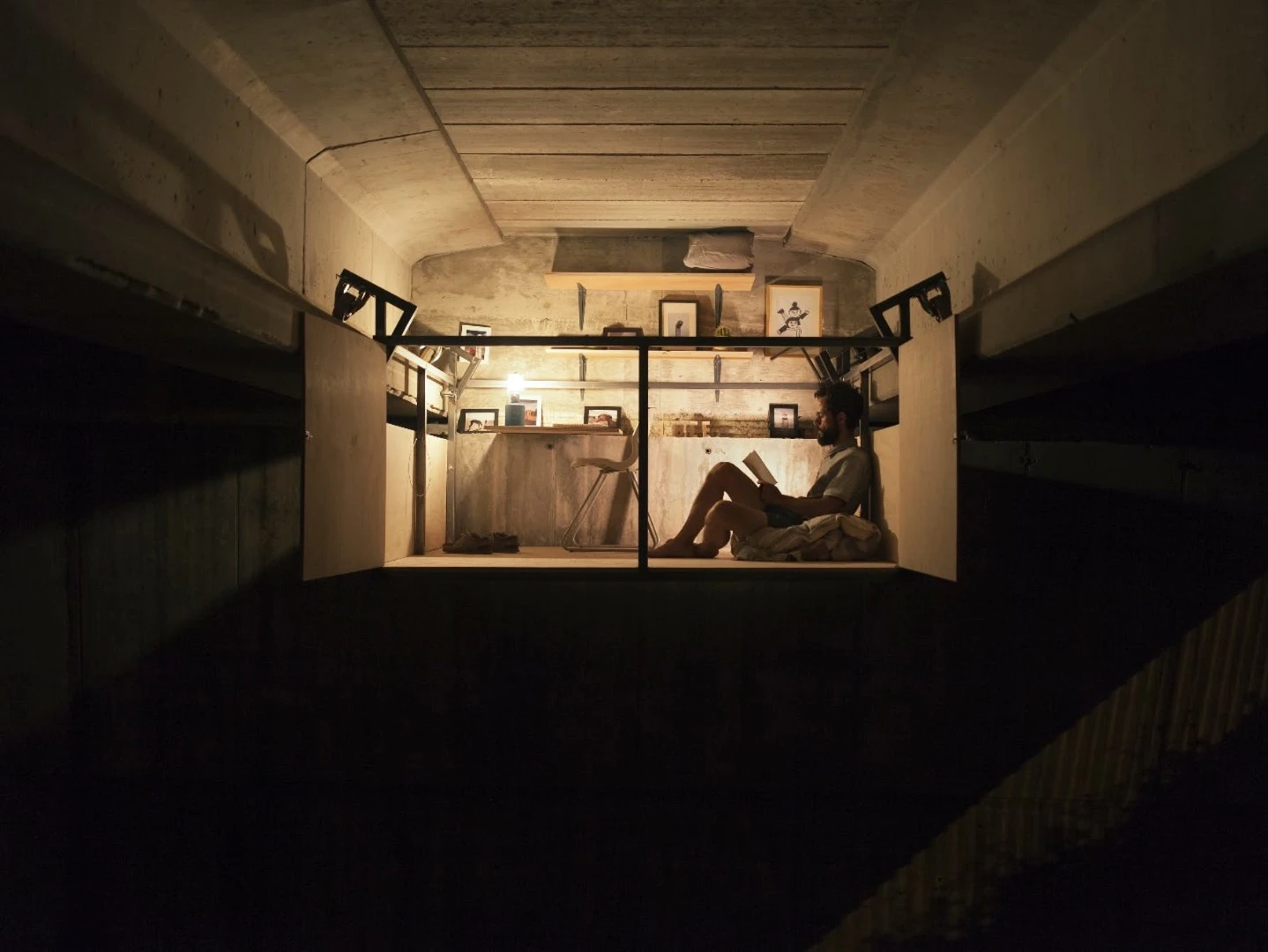 Under a bridge in Spain, designer Fernando Abellanas built this whimsical shelter, called Hidden Studio, cleverly using the existing beams of the bridge to parasitically hang his new office space off