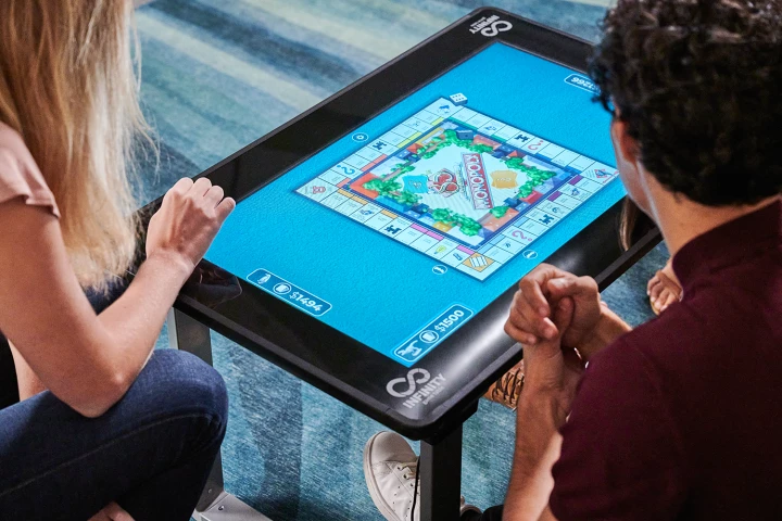 The Infinity Game Table digitizes dozens of board games like Monopoly and Scrabble