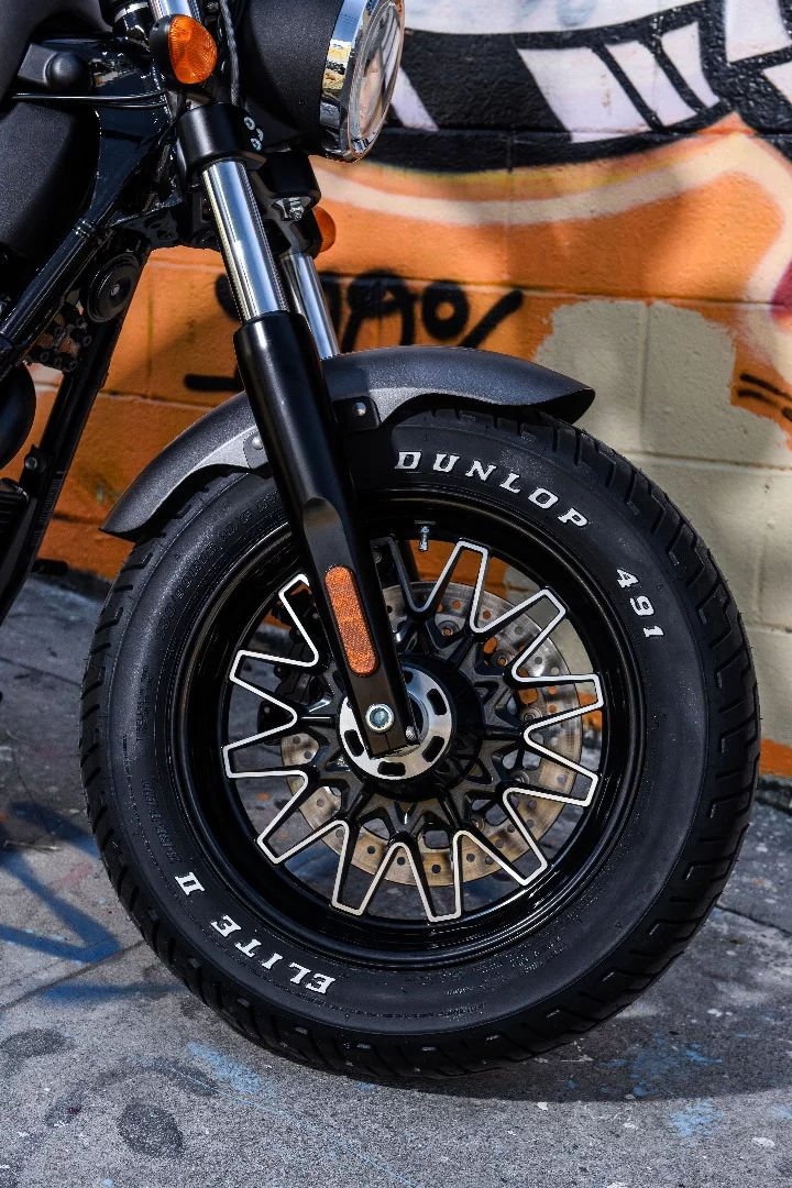 Cast wheels with fat Dunlop Elite II tires complete the muscle look of the 2017 Victory Gunner