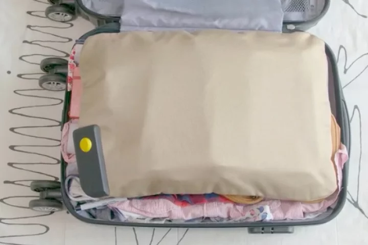 PaQ consists of a main device (lower left, in suitcase) that's attached to an inflatable bladder