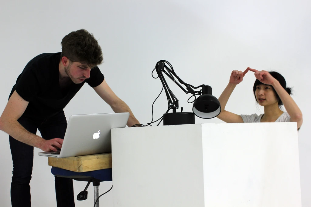 Adam Ben-Dror and Shanshan Zhou work out the final details of their interactive desk lamp, Pinokio