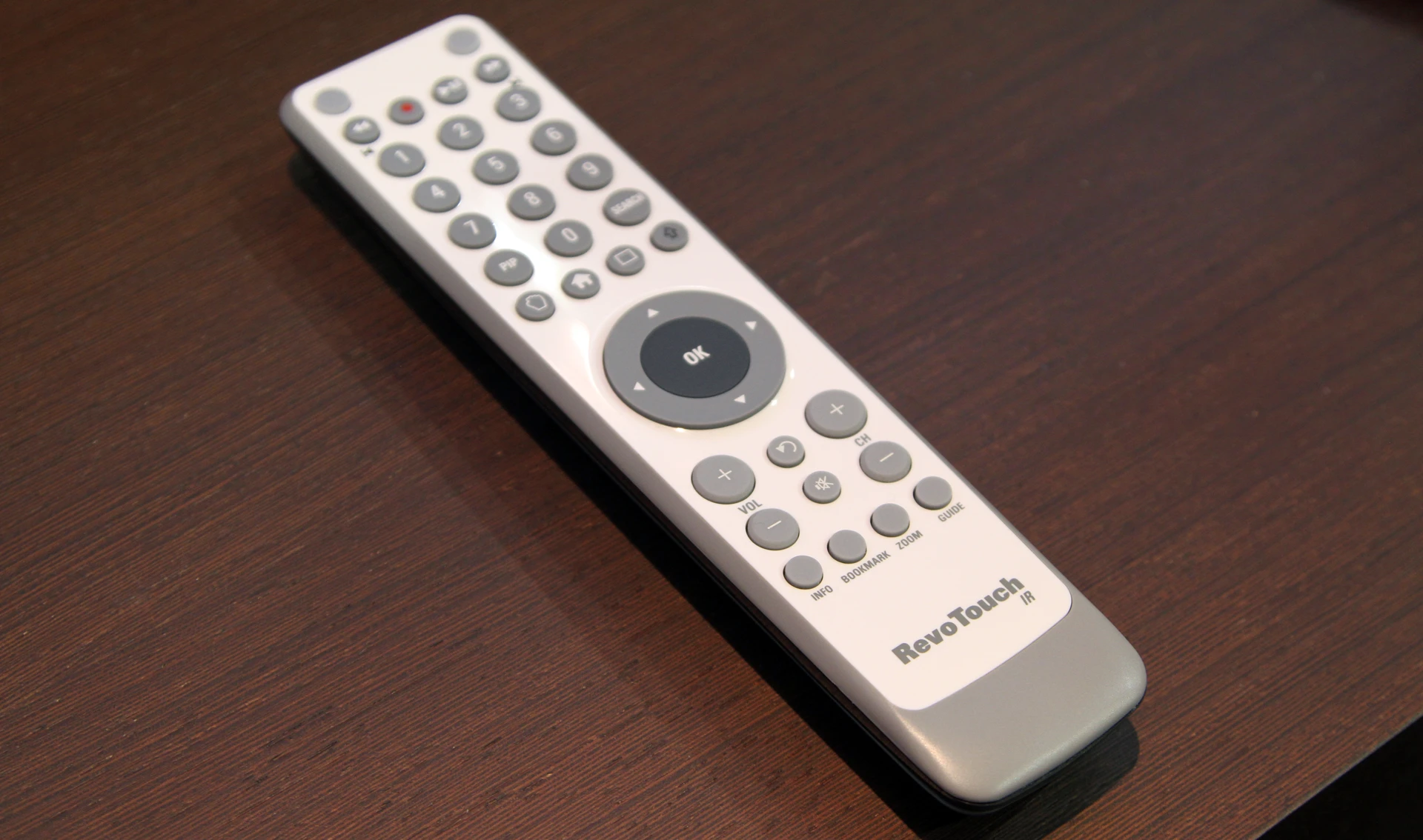An IR remote control prototype with RevoTouch technology that turns the circular directional and OK buttons acting into a touchpad