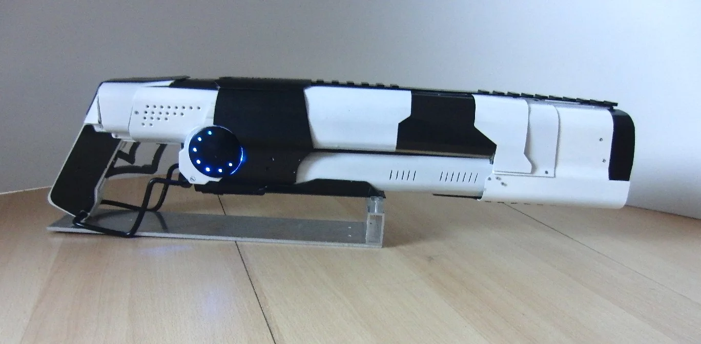 Power comes from an 18-volt rechargeable battery pack converted to run at 12,000 volts, while a 12-volt pump circulates one liter of distilled water to help keep things cool