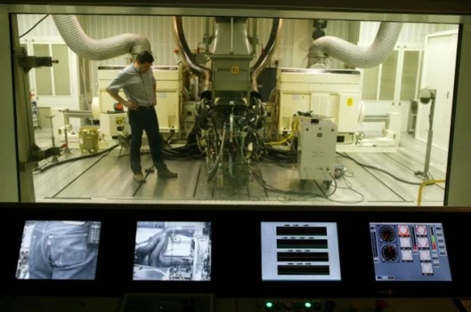 Setting up the engine for a run to test parts