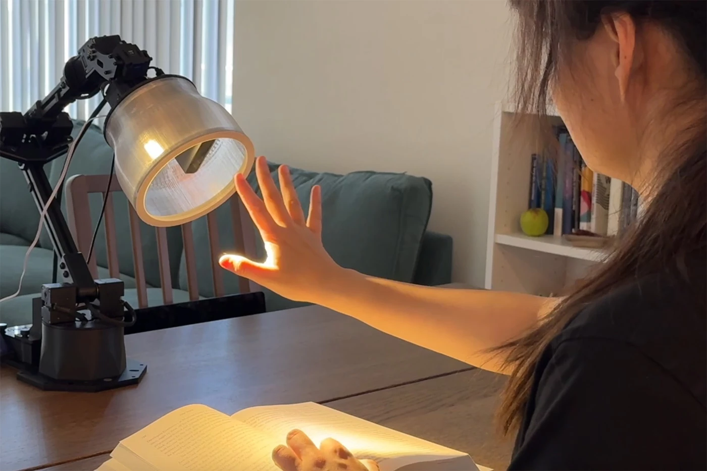 The robot lamp responds to the researcher with 'lifelike' gestures of its own