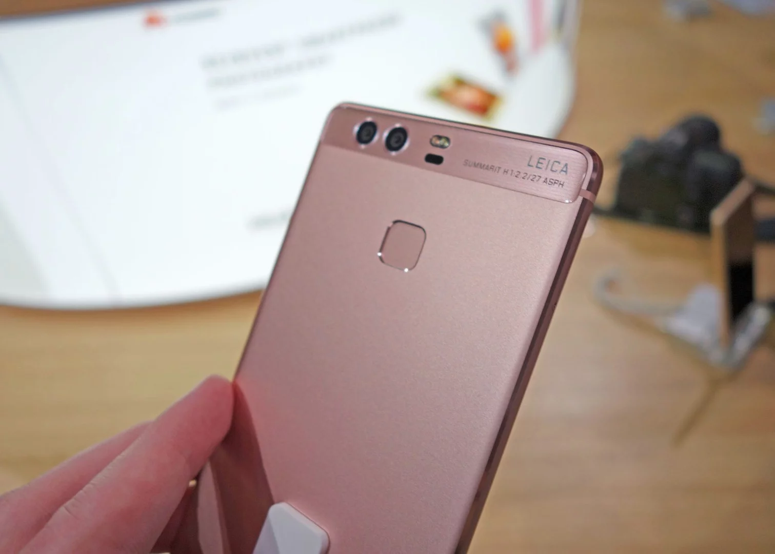 A fingerprint sensor sits on the rear with the dual-lens camera