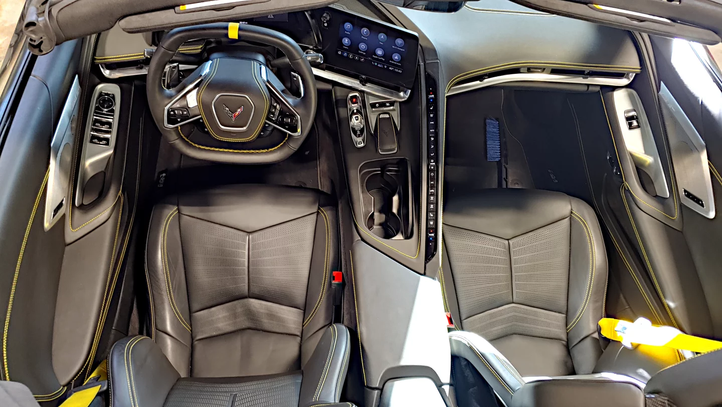 The overall feel of the 2020 C8 Corvette's interior is one of a flight deck from aircraft, with the line of buttons along the center console dividing the two seats