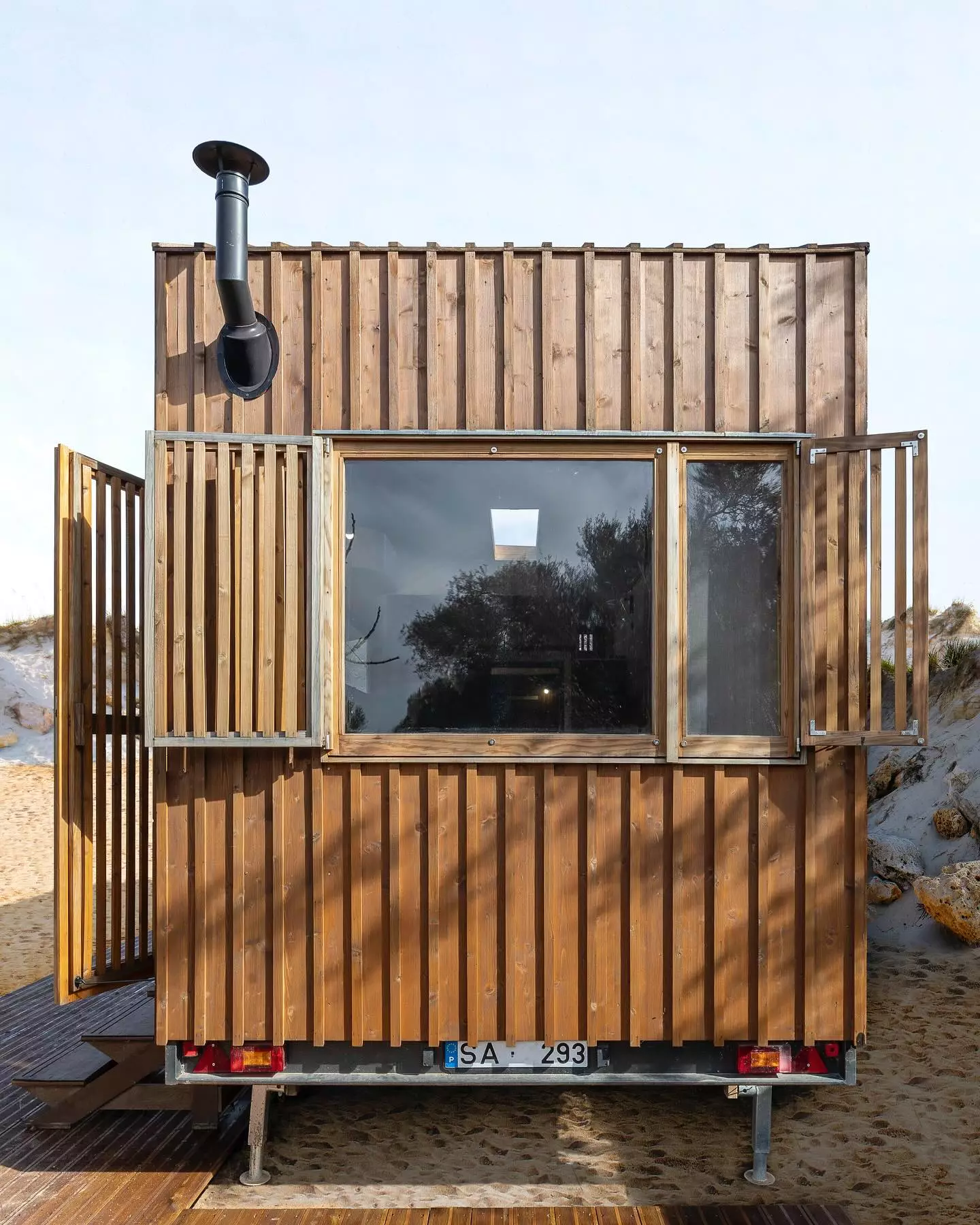 The Raposa's generous glazing can be covered with wooden shutters