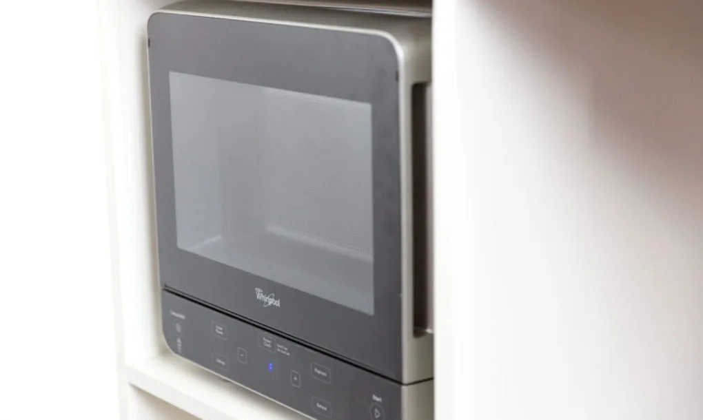 The Minim Workspace includes a sink and fridge area, and a microwave