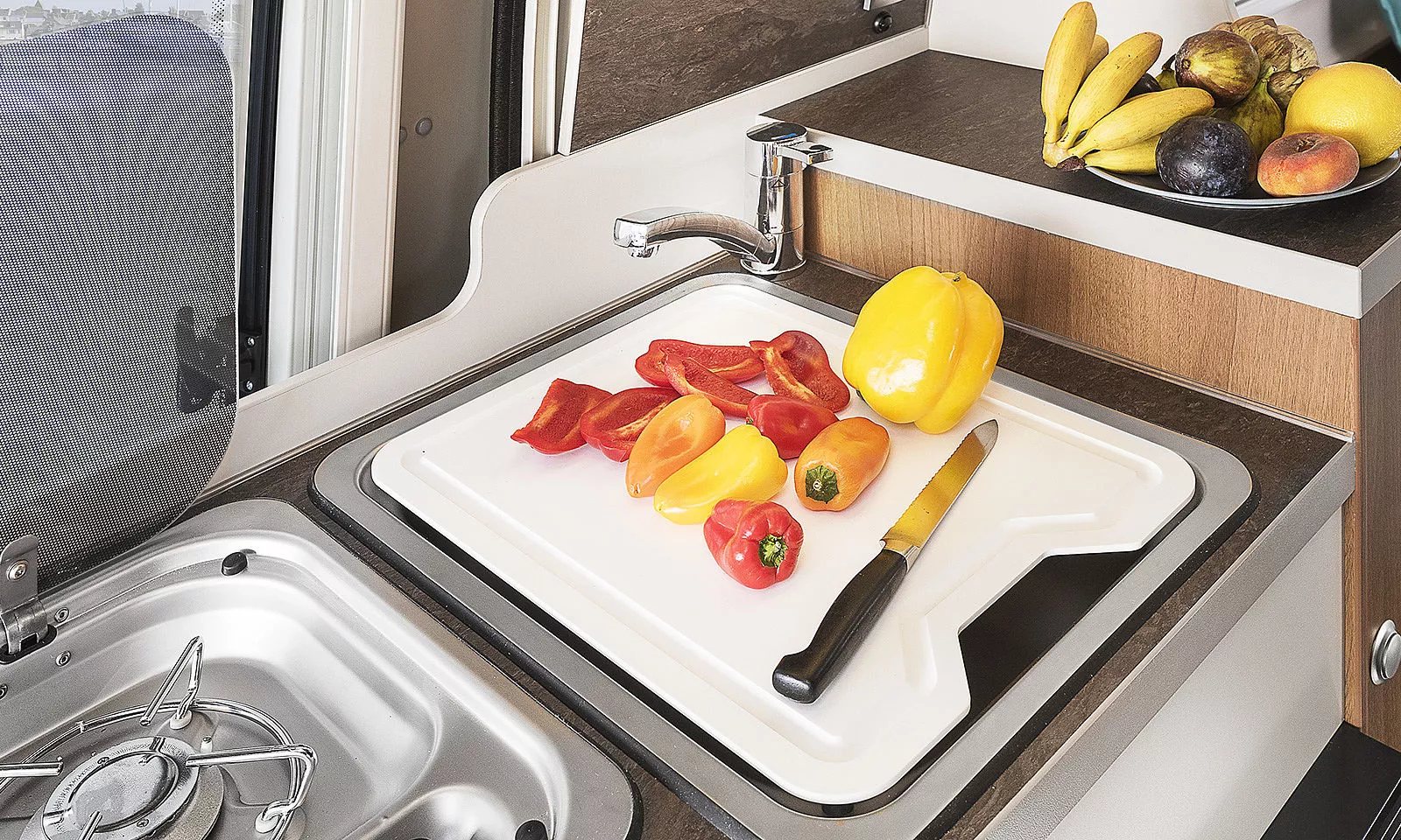 The chopping board sink cover is offered on some of the models, while others have a glass top