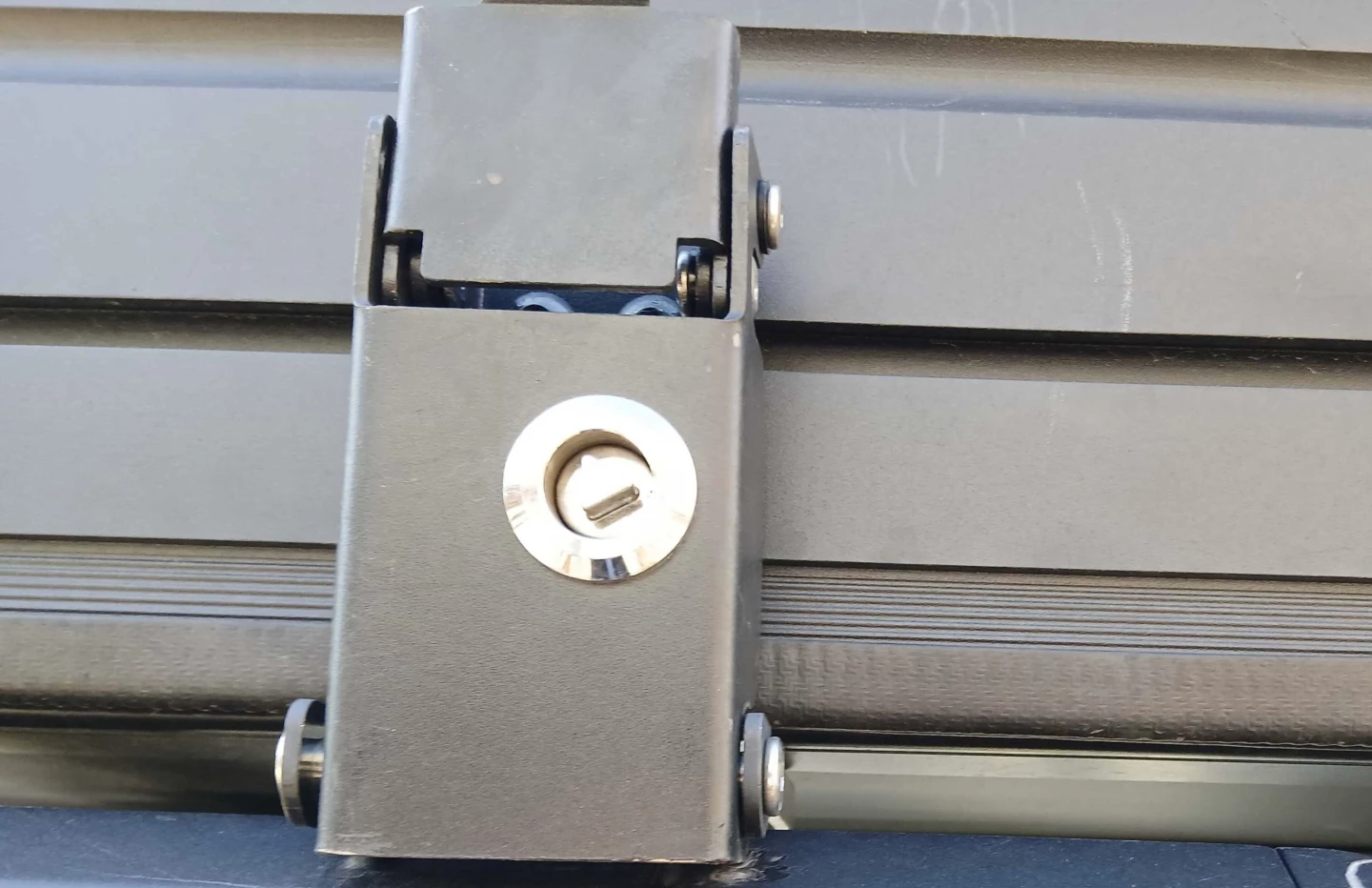 The Vision XL latch closed over the on the tent base, its round triangular-core lock just taunting me