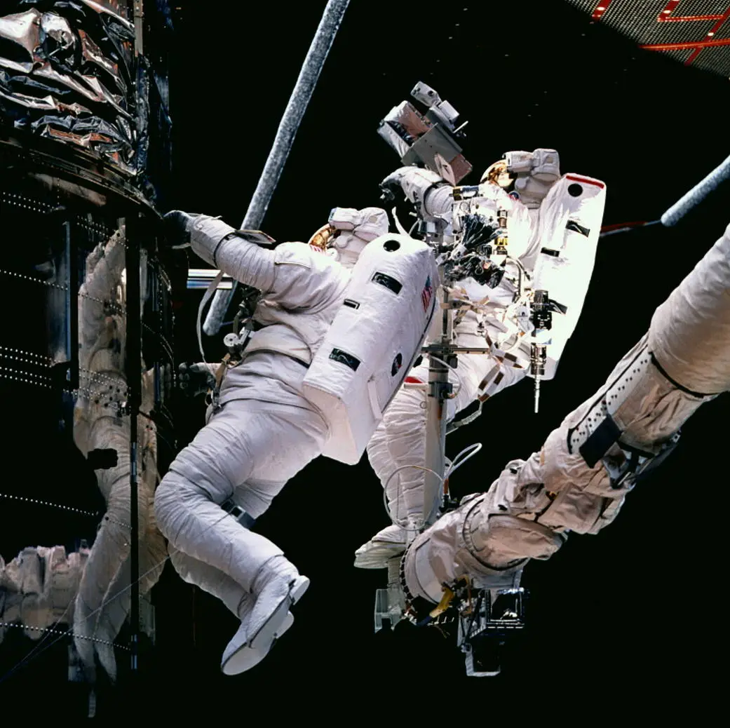 Astronauts servicing the Hubble Space Telescope
