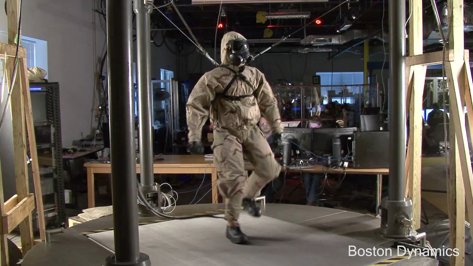 Boston Dynamics' PETMAN walks on a treadmill in a mock chemical exposure chamber