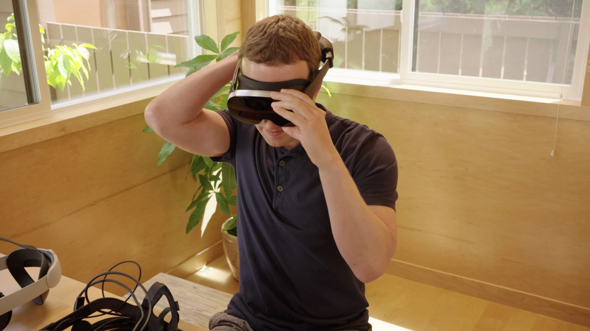 Mark Zuckerberg tries on the Holocake 2 prototype