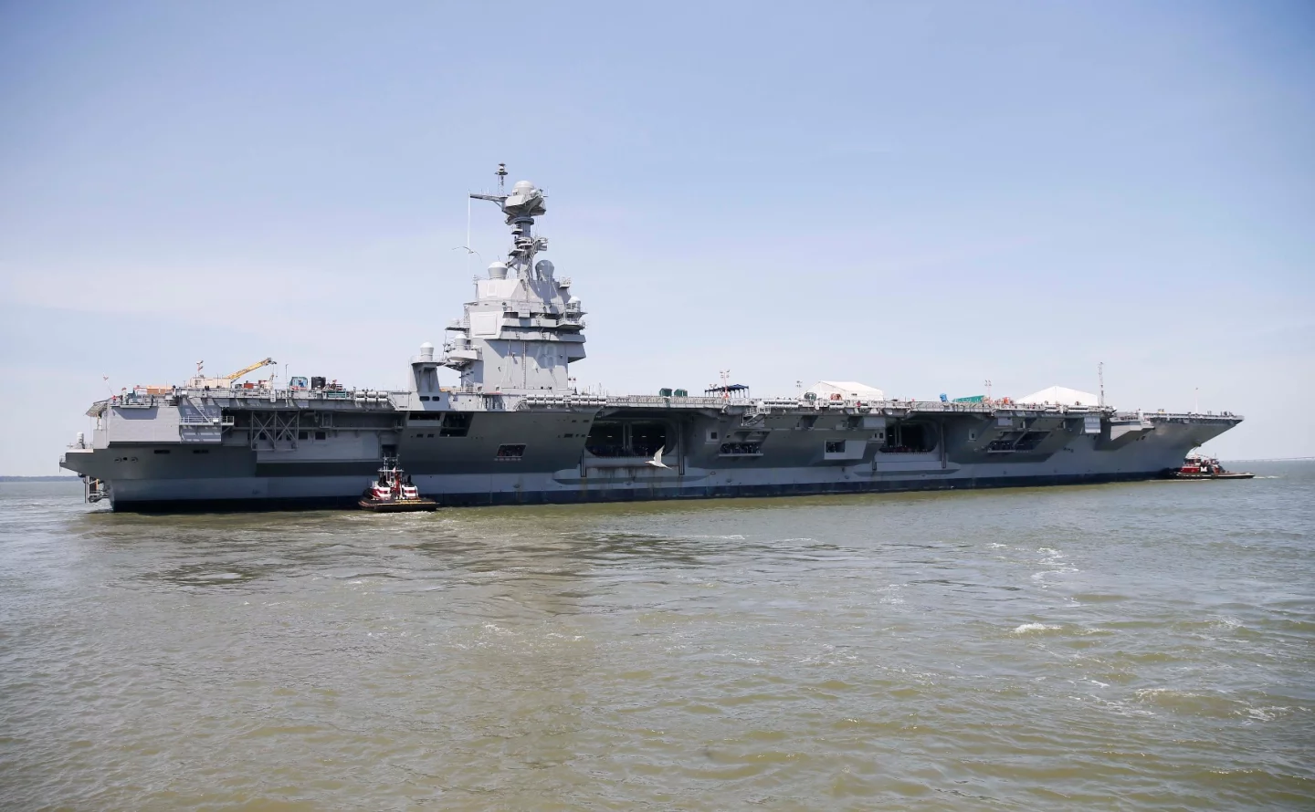 USS Gerald R. Ford (CVN-78) transits the James River during the ship's launch and transit to Newport News Shipyard