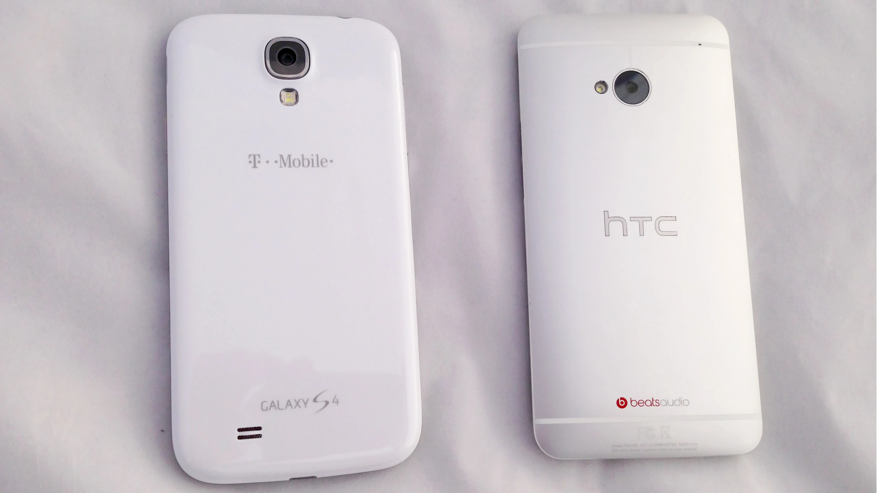 The GS4 (left) is made of plastic, while the One is made of aluminum