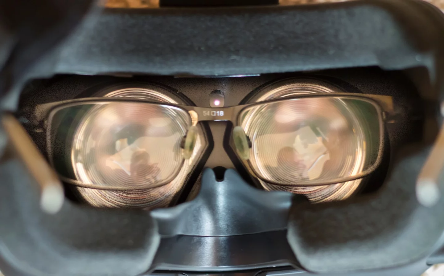 A pair of glasses inside the HTC Vive Pre