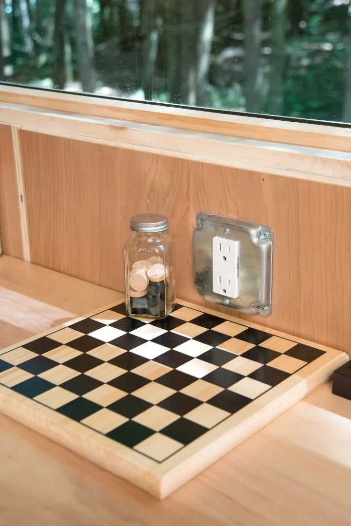 Constructed primarily from timber, the Lorraine is dominated by an open space comprising living, dining and work areas, with a long work surface spanning from kitchen to bedroom