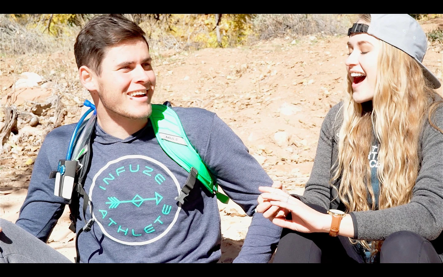 The Infuze device (on shoulder strap, at left) adds supplements to water drawn from a hydration pack