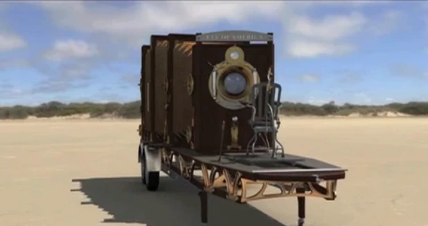 The gigantic camera is fashioned after traditional film cameras of the past, sporting veneers of recycled wood, leatherette, and brass fittings