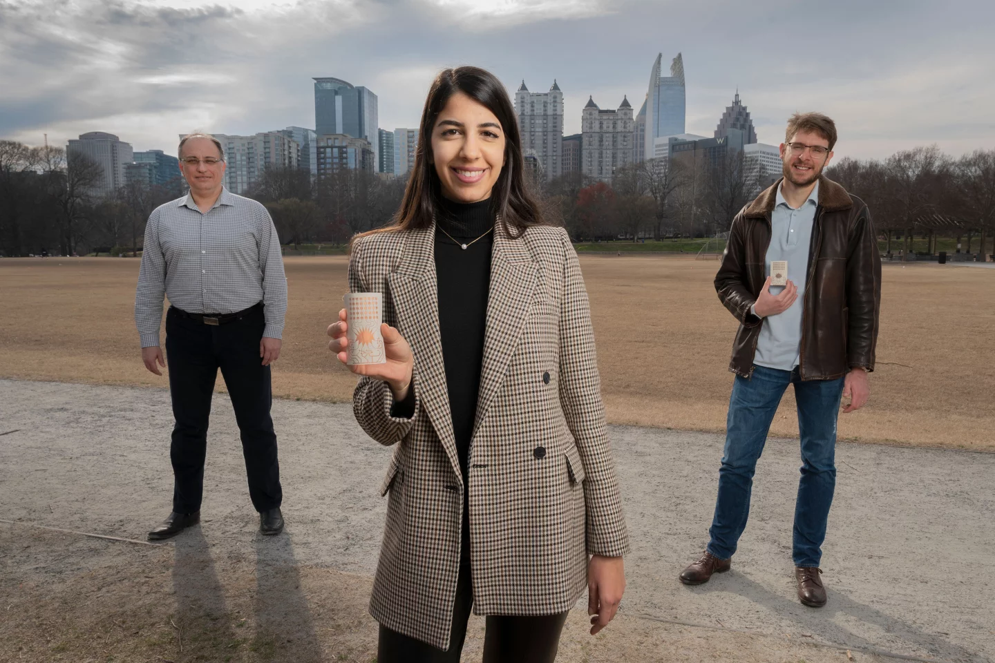 Georgia Tech researchers Aline Eid (center), Manos Tentzeris (left), and Jimmy Hester (right) have developed a flexible Rotman lens-based rectifying antenna system for 5G energy harvesting that could eliminate the world’s reliance on batteries for powering devices.