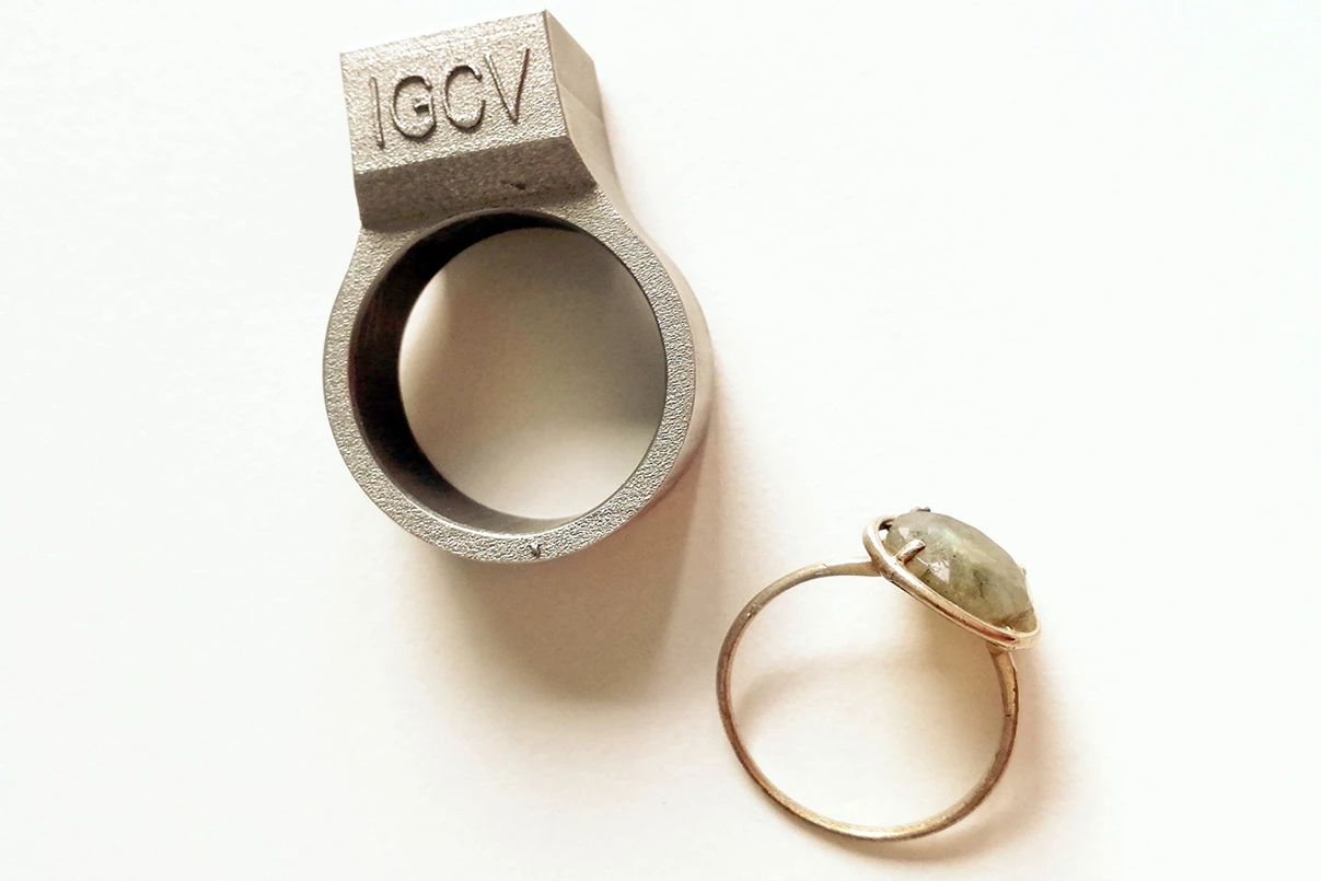 The prototype smart ring (top), alongside a regular ring for scale