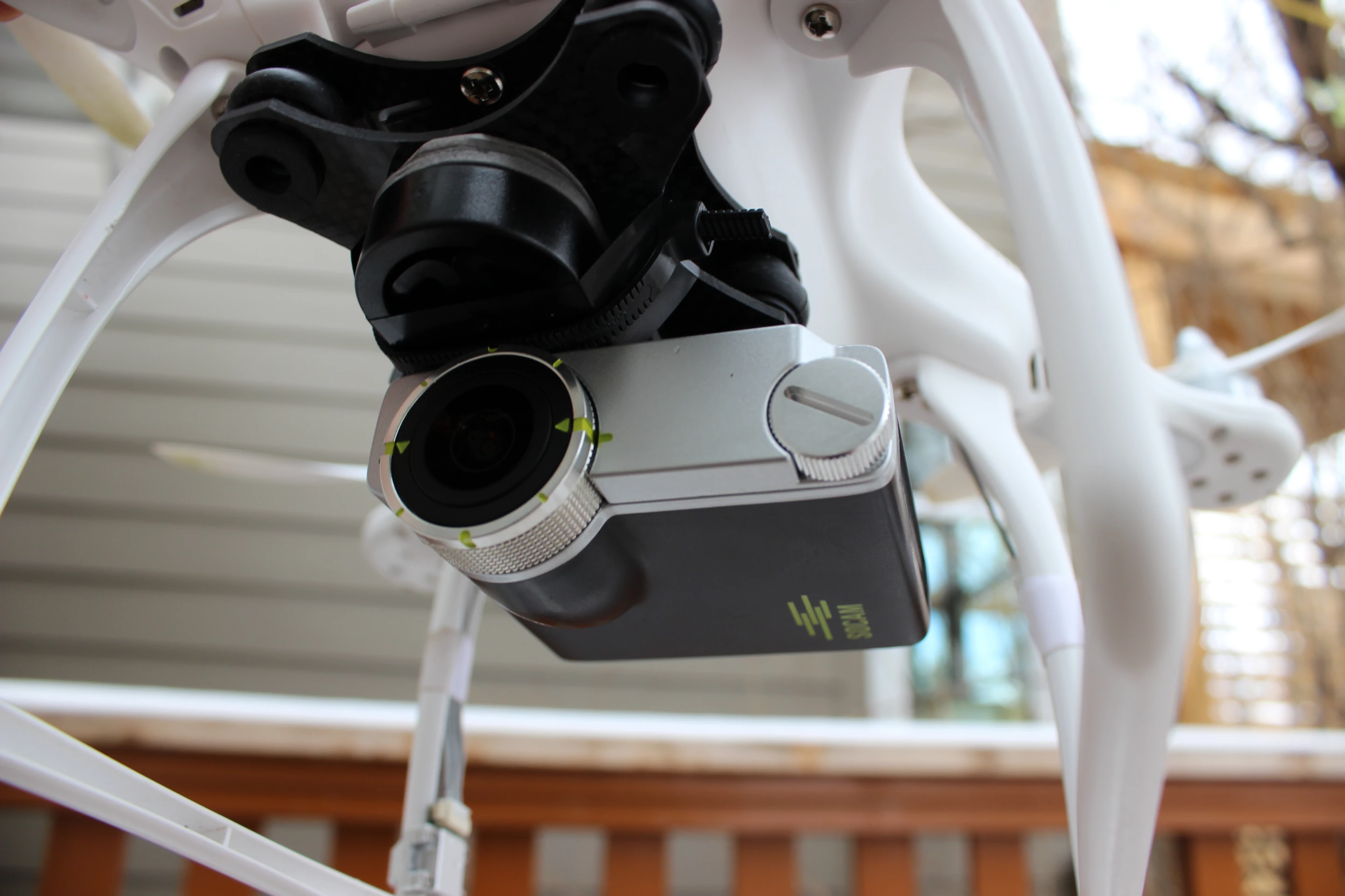 The Socam UltiMate, jerry-rigged to the underside of a DJI Phantom quadcopter