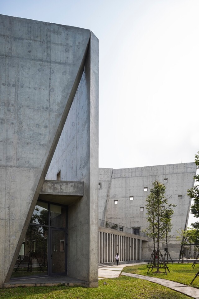 "The V-shaped walls are designed to be high to cut strong harsh sunlight from east and west, while giving an impressive exterior facade for the entrants," explains VTN Architects