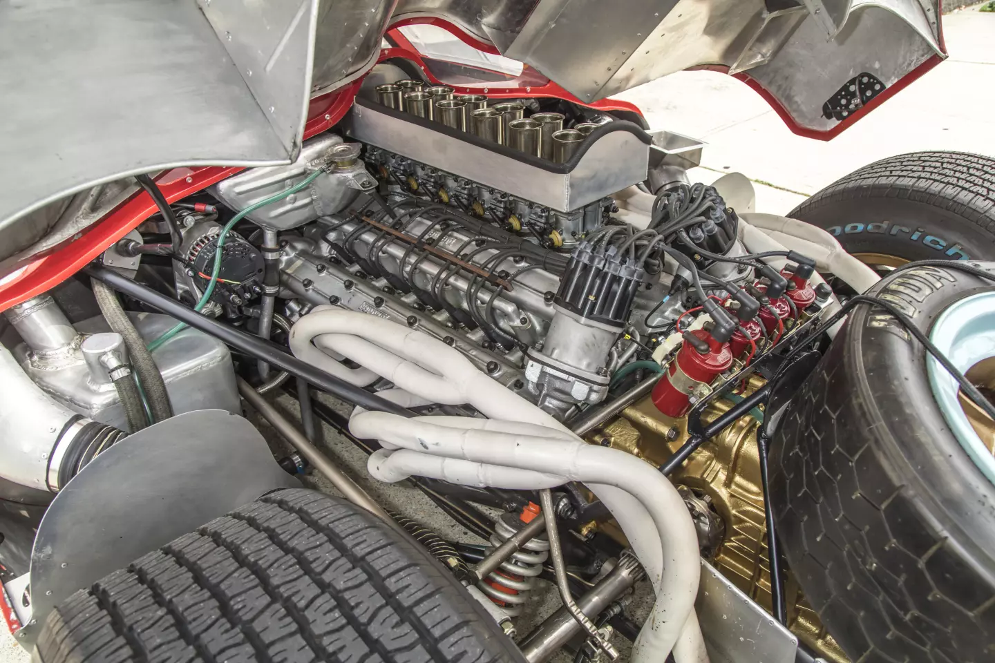 A look under the cowling shows the enormity of the DOHC V12 engine which is still detailed by Ferrari on its web site. The two-valve per cylinder 4-litre powerplant was carried over from the previous year's prototype Scuderia Ferrari, but with six massive 40DCN/15 Weber carburettors in place of the injection system. The end result was 420bhp at 8,000rpm, driving through the 5-Speed Ferrari transmission.