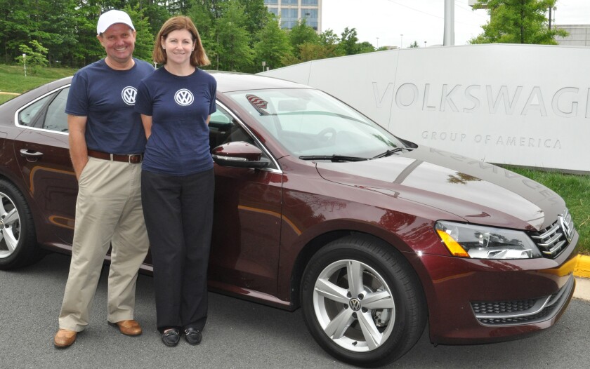 John and Helen Taylor beside the VW Passat they traveled 1,626.1 miles in on one tank of diesel