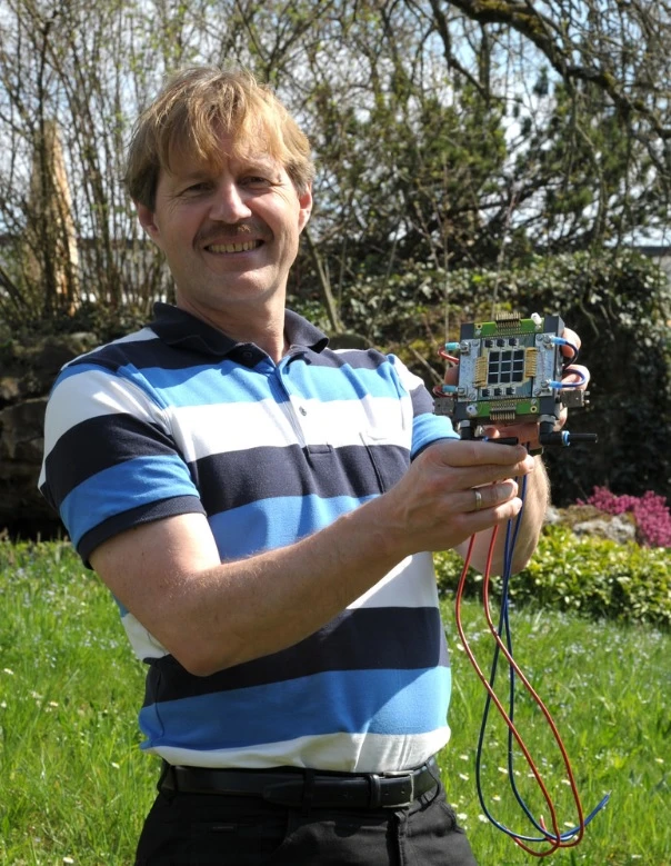 IBM scientist Dr. Bruno Michel holds the receiver design package (Photo: IBM)