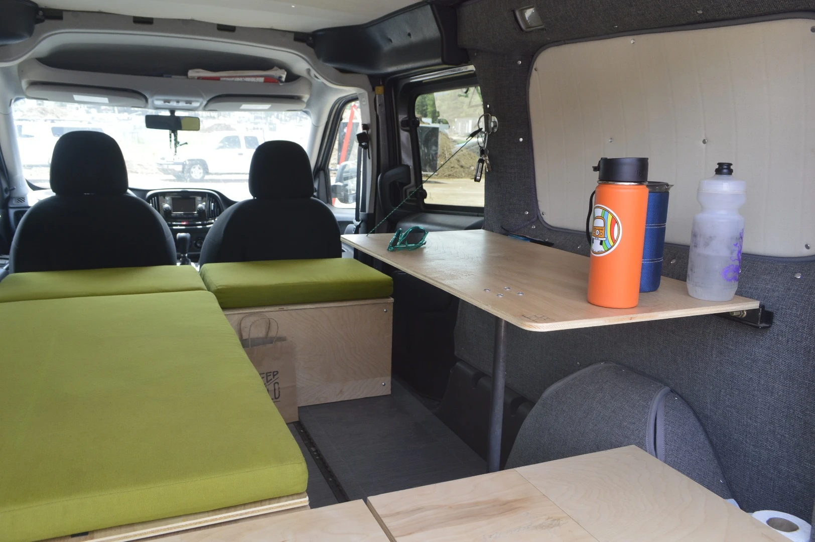The table folds up during transit and down at camp