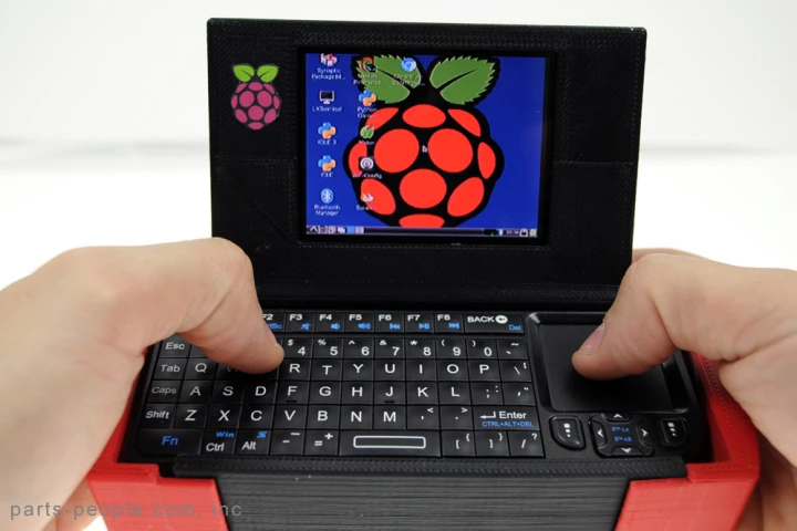 Founder and CEO of Parts-People, Nathan Morgan, has built a feature-packed portable PC around the Raspberry Pi board and packed everything into a colorful 3D-printed case