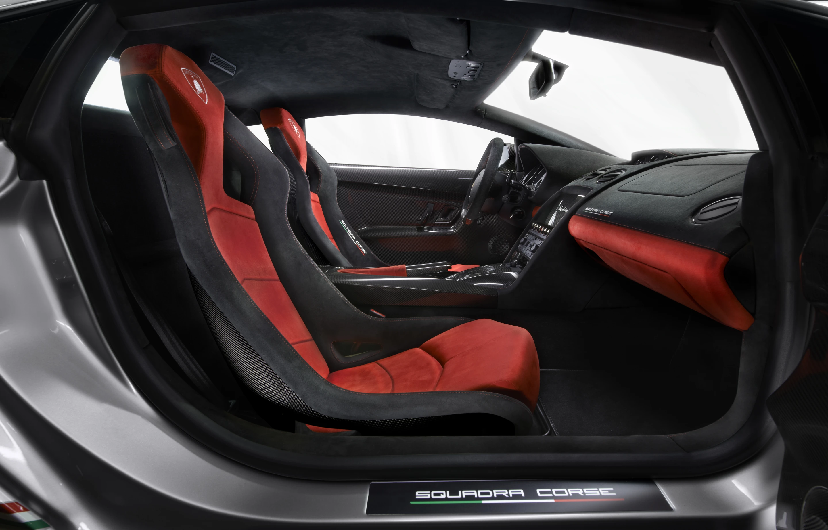 Door panels, racing seats, center console cover and other components are made of carbon fiber, while Alcantara works to soften the mood
