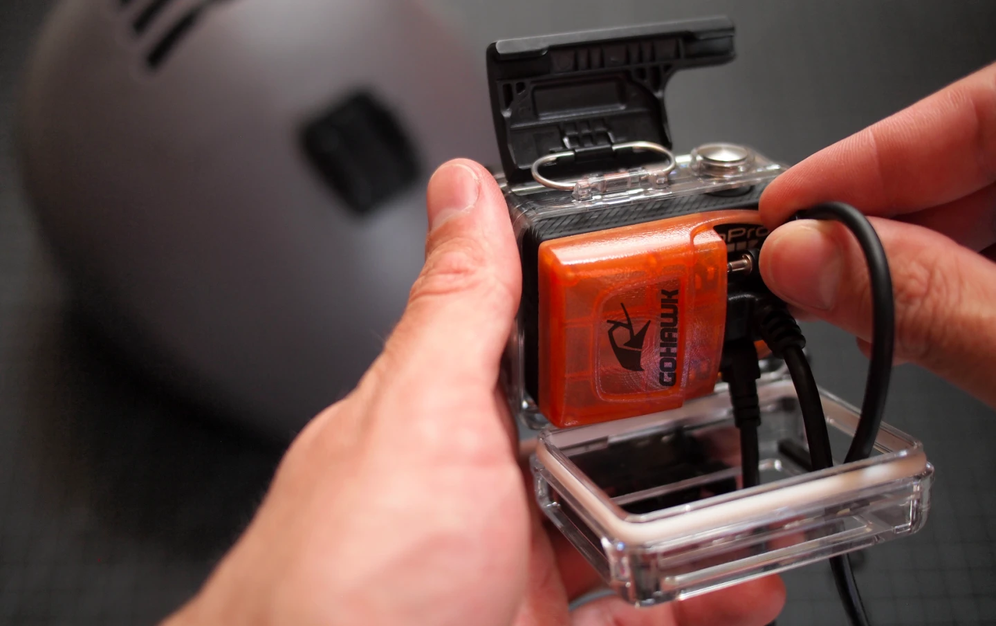 A GoPro housing can still be used with the GoHawk, if it's the type with an opening in the back