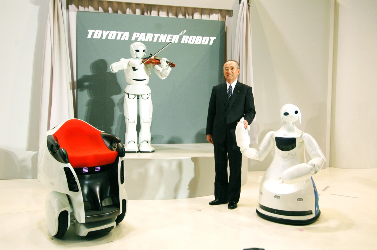 Toyota has an entire division creating rehabilitiation, mobility and partner robots. The chair at left is yet another of a vast array of mobility options at the disposal of the giant