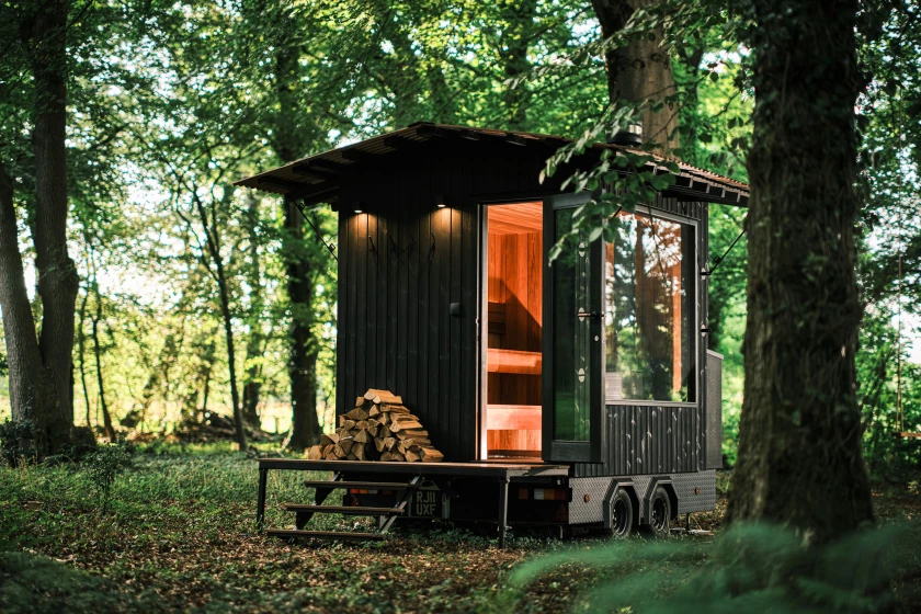 Though it looks a lot like a tiny house at first glance, the Aquila Sauna is actually a towable sauna that seats up to six people