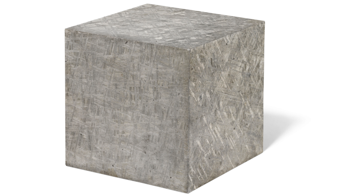 Extraterrestrial steel | Price: $31,741 (£25,000) | Auction Link | The Muonionalusta meteorite impacted in northern Scandinavia about one million years BCE. The first fragment was found in 1906 and around forty pieces are known today, of which this is one. Modern cutting has highlighted the meteorite's octahedrite crystalline fingerprint in three dimensions, resulting in a 13.1 kg cube with 4¾ inch (12cm) sides. This dense iron-nickel sculpture is in effect, extraterrestrial steel.